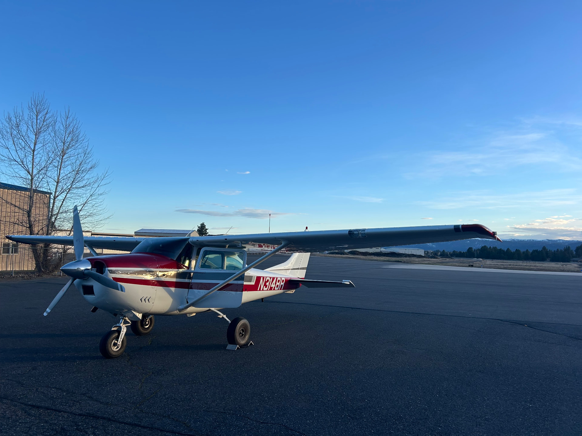 Cessna 182 N3148R on the ramp at sunset